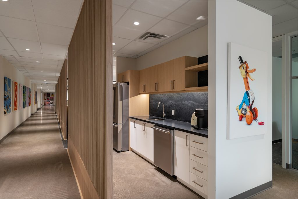 Custom fabricated architectural millwork with luxury commercial wood finishes, architectural detailing, built-in cabinetry, and corporate office interiors.