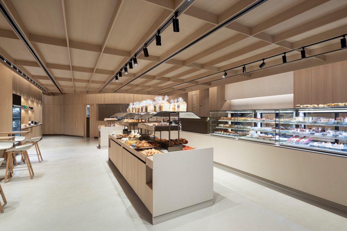Feature architectural ceiling with custom commercial millwork, integrated lighting, and premium interior wood finishes.