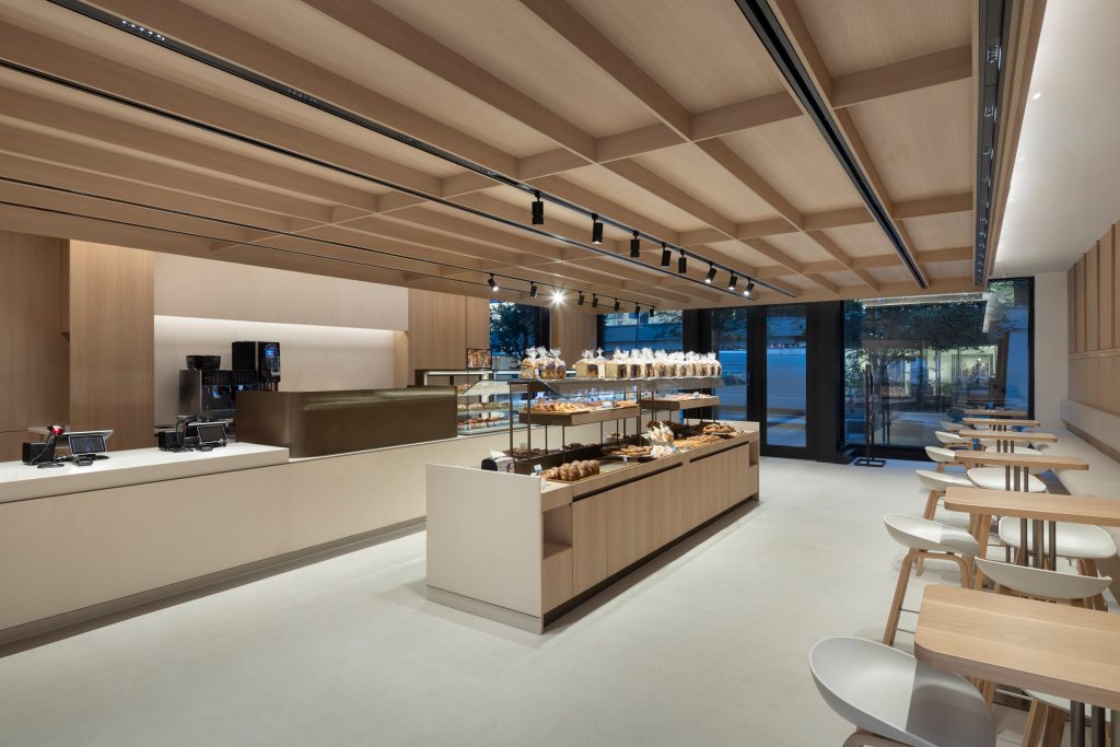 Contemporary commercial bakery featuring custom millwork, architectural wood finishes, and precision-crafted interior detailing.