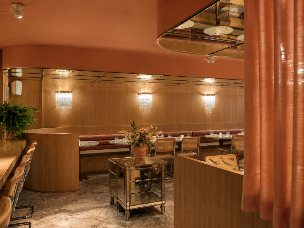 Contemporary restaurant showcasing architectural wood cladding, custom restaurant millwork, built-in cabinetry, feature bar millwork and commercial interior craftsmanship.