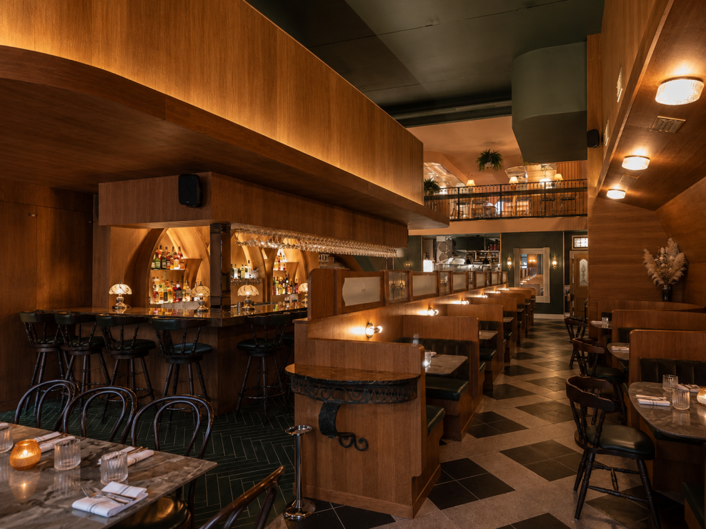 Architectural commercial millwork for restaurants including custom wood wall cladding, restaurant cabinetry, feature bar systems and bespoke booth seating.