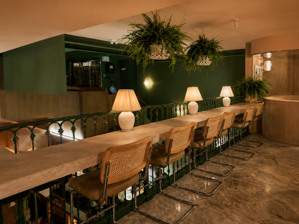 Custom restaurant millwork featuring architectural wood wall cladding, premium restaurant cabinetry, custom booth seating and hospitality interior finishes by Boreal Architectural.