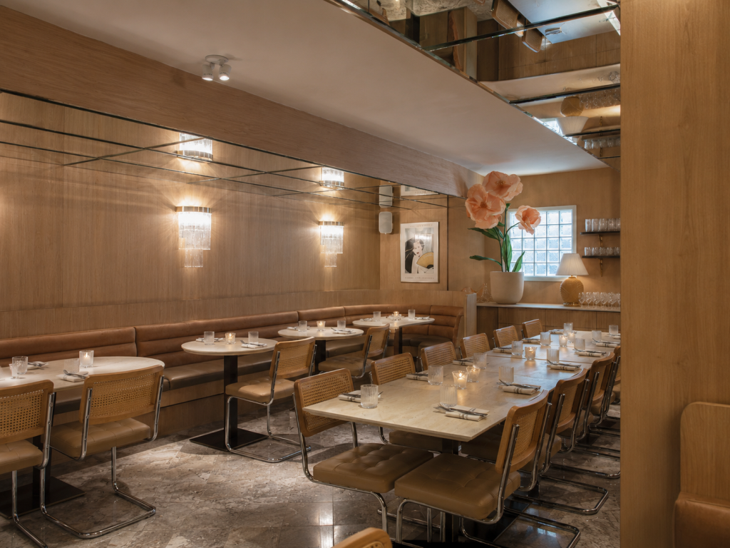 Architectural restaurant interior with custom millwork, restaurant cabinetry, decorative wood wall cladding, feature bar construction and commercial wood finishes.