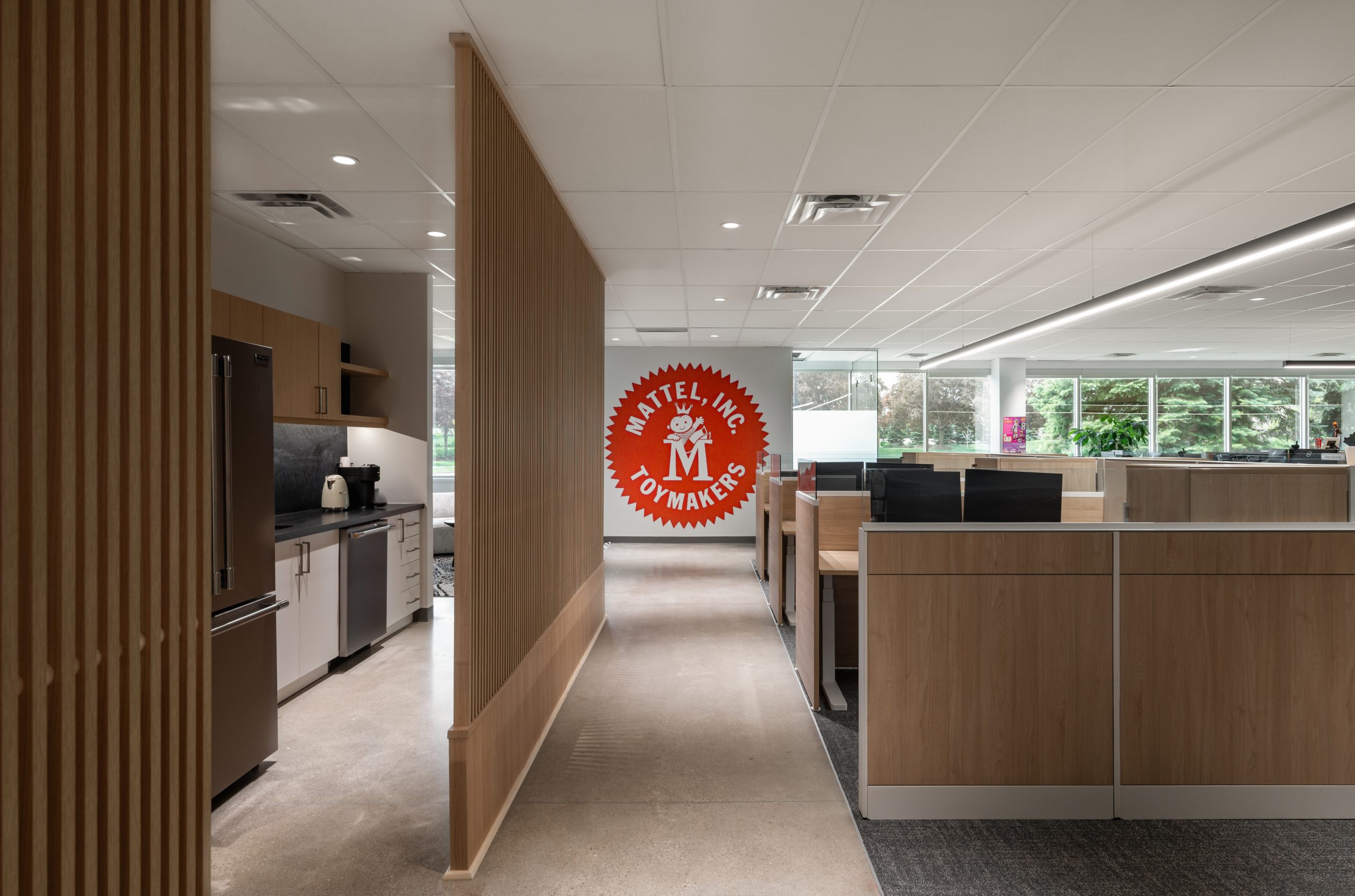 Premium architectural millwork finishes featuring custom wood veneer cabinetry, commercial casework, architectural wall panels, and integrated corporate office interiors.