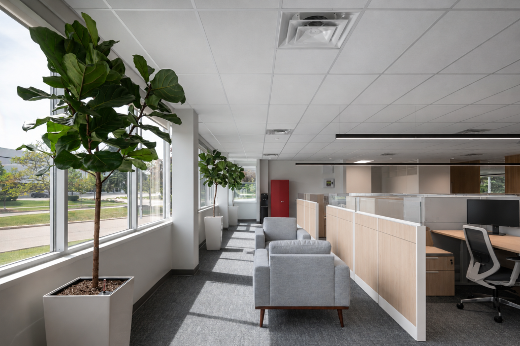 Precision-manufactured architectural millwork with seamless wood finishes, commercial cabinetry, feature walls, and integrated interior systems.