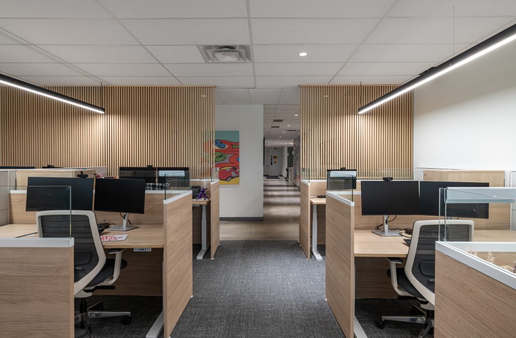 High-end commercial millwork showcasing custom cabinetry, architectural wood finishes, feature walls, and precision-crafted office interiors.