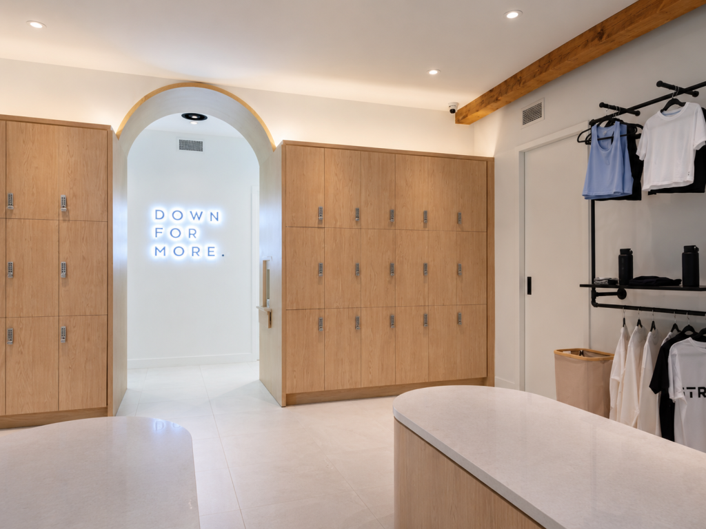 Architectural millwork by Boreal Architectural showcasing custom locker systems, integrated bench seating, premium wood finishes, and commercial wellness facility interior solutions.