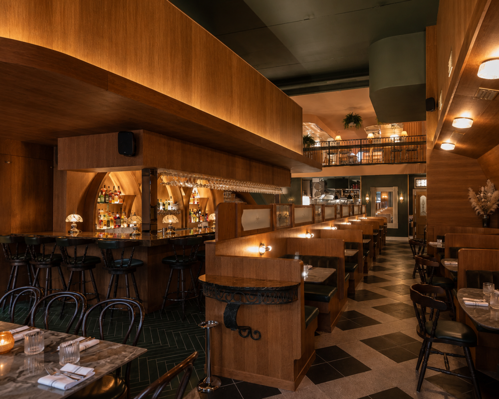 Architectural commercial millwork for restaurants including custom wood wall cladding, restaurant cabinetry, feature bar systems and bespoke booth seating.