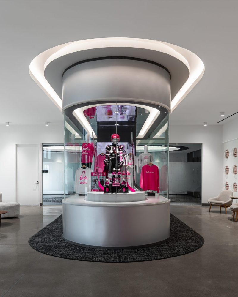 Custom commercial millwork package including architectural woodwork, cabinetry, paint-grade finishes, slat wall systems, and integrated workplace interiors.